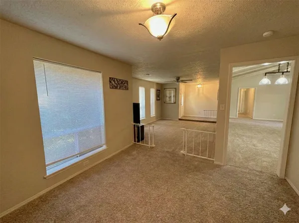 a view of empty room with a glass door