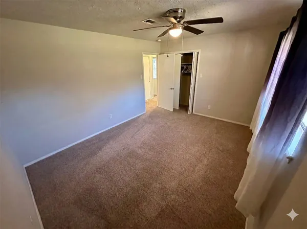 a view of empty room with windows