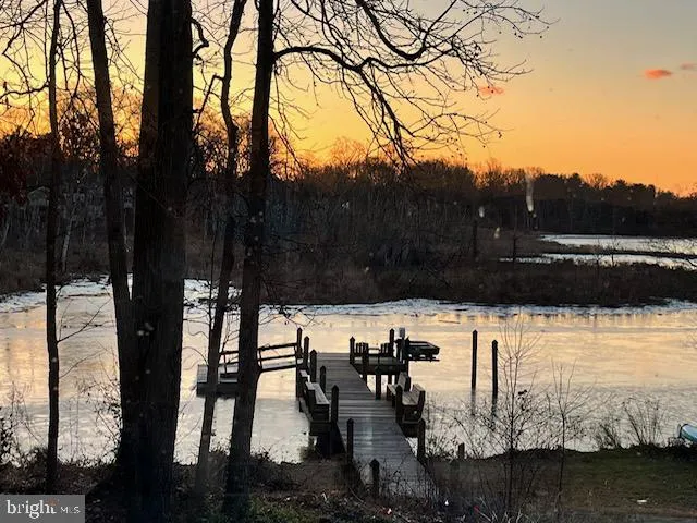 a view of house with outdoor space and sitting area