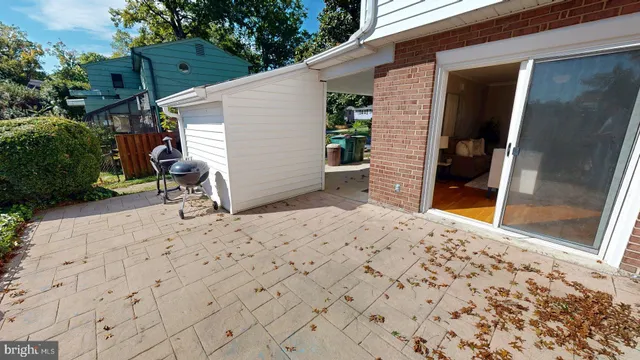 a living room with furniture potted plant and a window