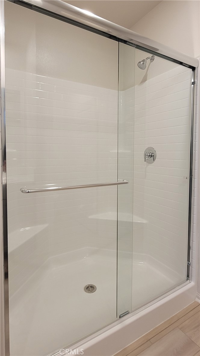 32916 Earlsburn Circle Menifee, CA 92584 - Photo 19 of 34 a bathroom with a shower