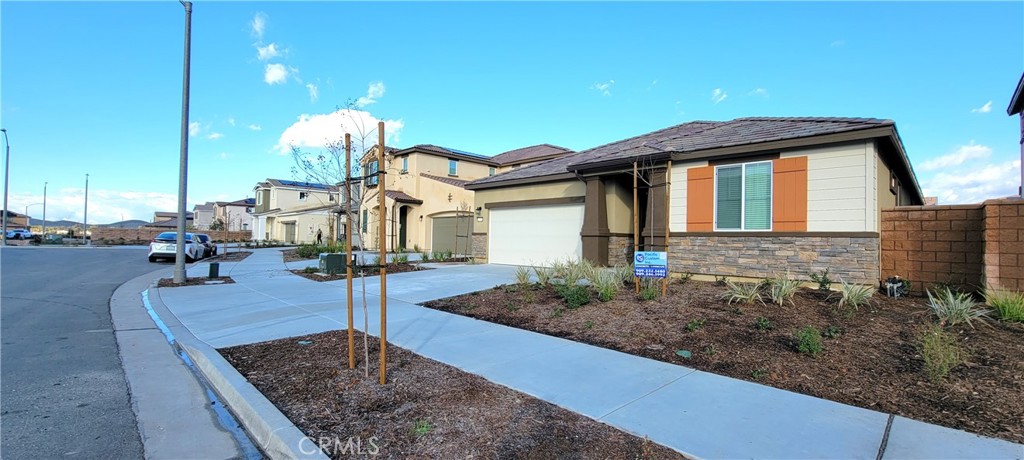 32916 Earlsburn Circle Menifee, CA 92584 - Photo 2 of 34 a front view of a house with garden