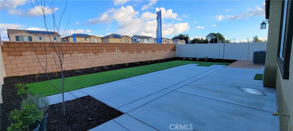 32916 Earlsburn Circle Menifee, CA 92584 - Photo 30 of 34 a view of a terrace with a garden