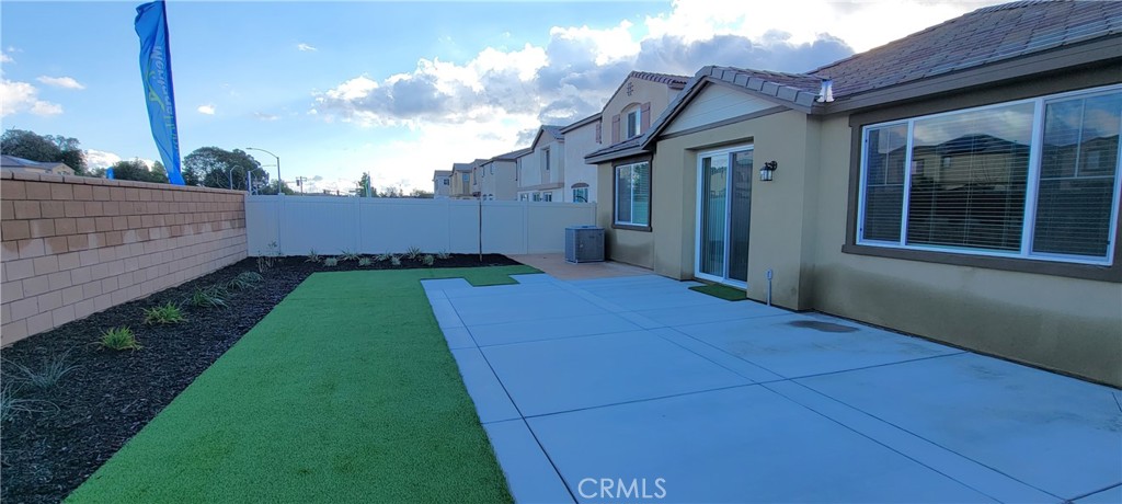 32916 Earlsburn Circle Menifee, CA 92584 - Photo 31 of 34 a backyard of a house with lots of green space