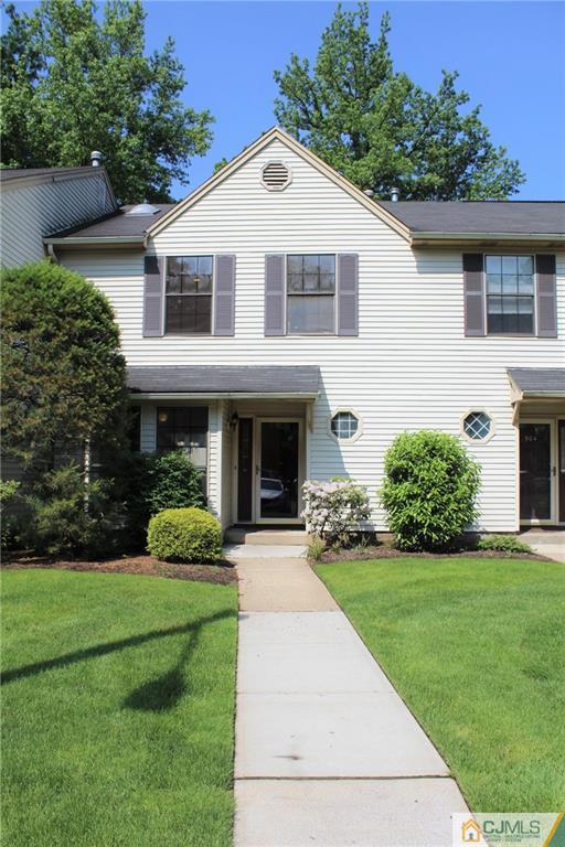 903 Timber Oaks Road, Unit 903 Edison, NJ 08820 - Photo 2 of 34 a front view of a house with a yard