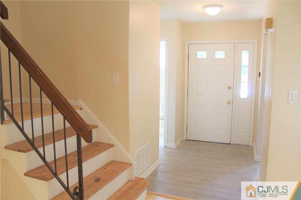 903 Timber Oaks Road, Unit 903 Edison, NJ 08820 - Photo 12 of 34 a view of a hallway with staircase