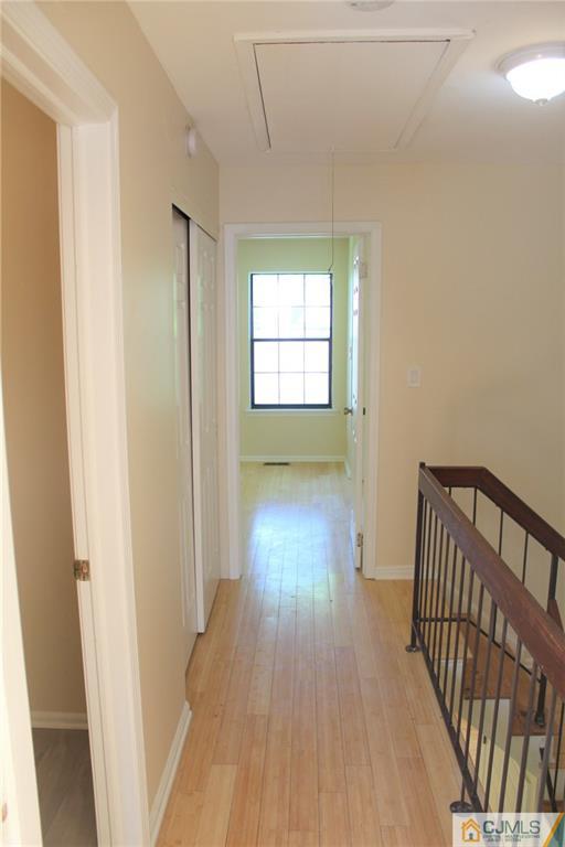 903 Timber Oaks Road, Unit 903 Edison, NJ 08820 - Photo 23 of 34 a view of hallway with wooden floor