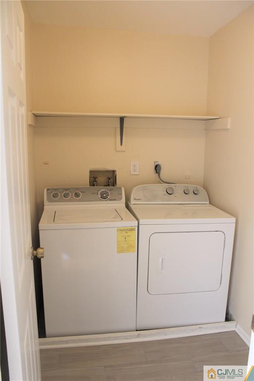 903 Timber Oaks Road, Unit 903 Edison, NJ 08820 - Photo 24 of 34 a utility room with dryer and washer