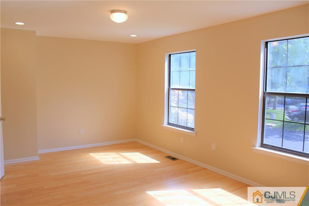 903 Timber Oaks Road, Unit 903 Edison, NJ 08820 - Photo 25 of 34 a view of empty room with windows