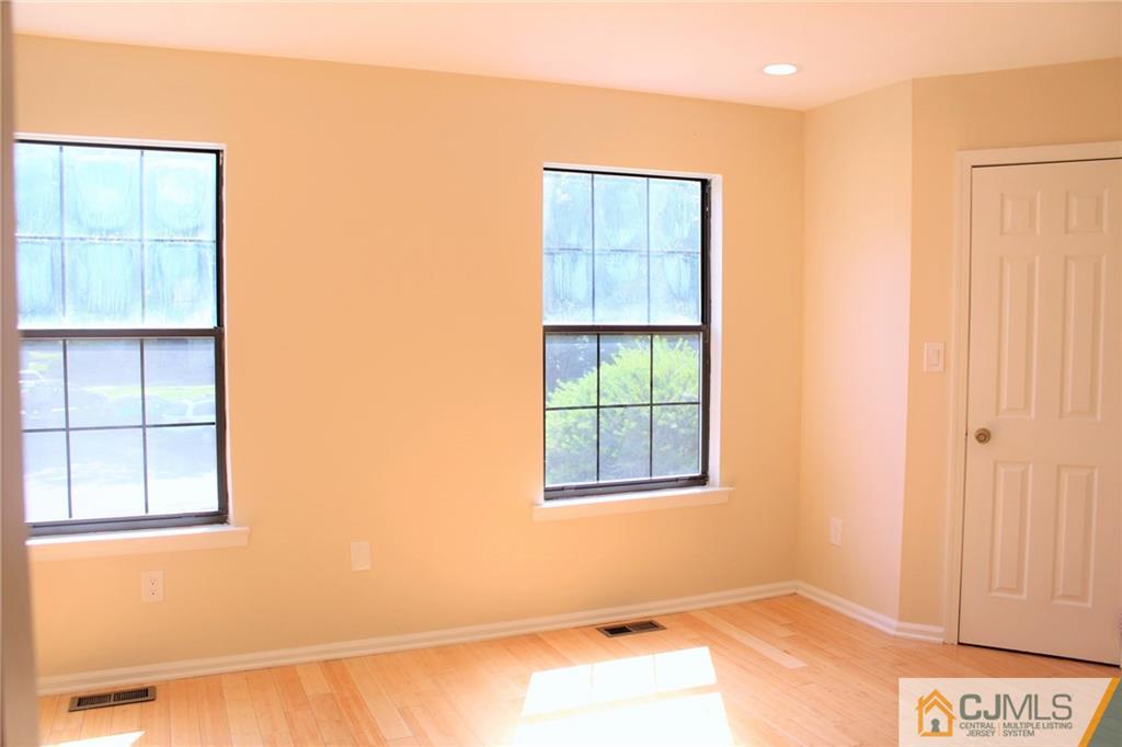903 Timber Oaks Road, Unit 903 Edison, NJ 08820 - Photo 26 of 34 an empty room with windows