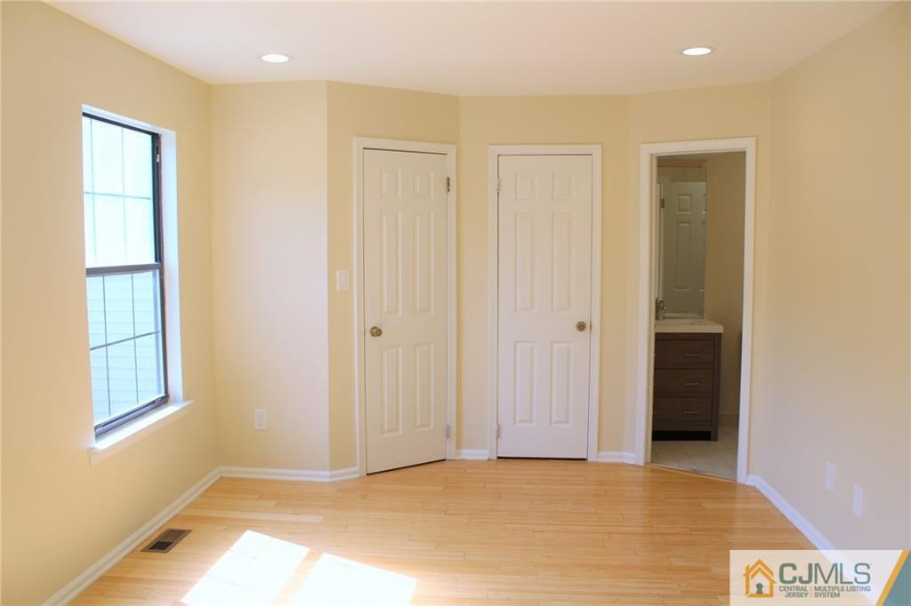 903 Timber Oaks Road, Unit 903 Edison, NJ 08820 - Photo 28 of 34 a view of an empty room with closet and a window