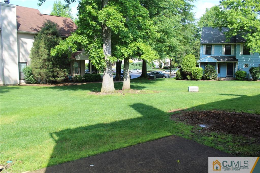 903 Timber Oaks Road, Unit 903 Edison, NJ 08820 - Photo 32 of 34 a view of a house with a yard