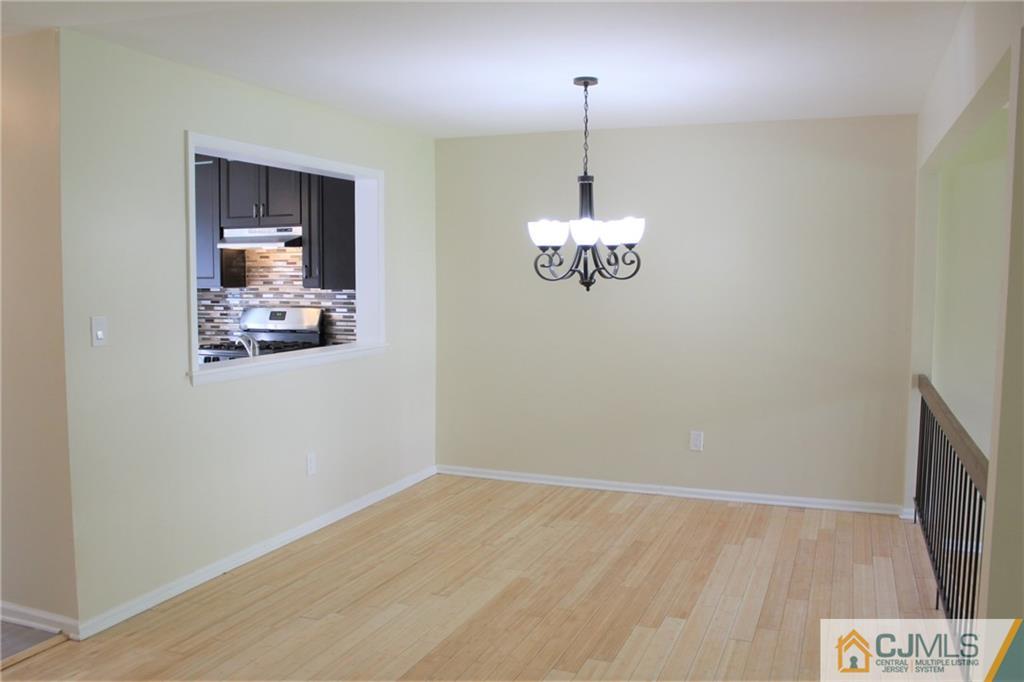 903 Timber Oaks Road, Unit 903 Edison, NJ 08820 - Photo 7 of 34 a view of a room with wooden floor