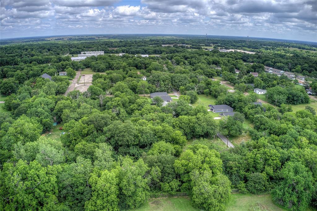 0 Sycamore Street Commerce, TX 75428 - Photo 2 of 14 an aerial view of a house with a yard