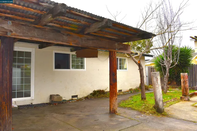 a backyard of a house with seating space