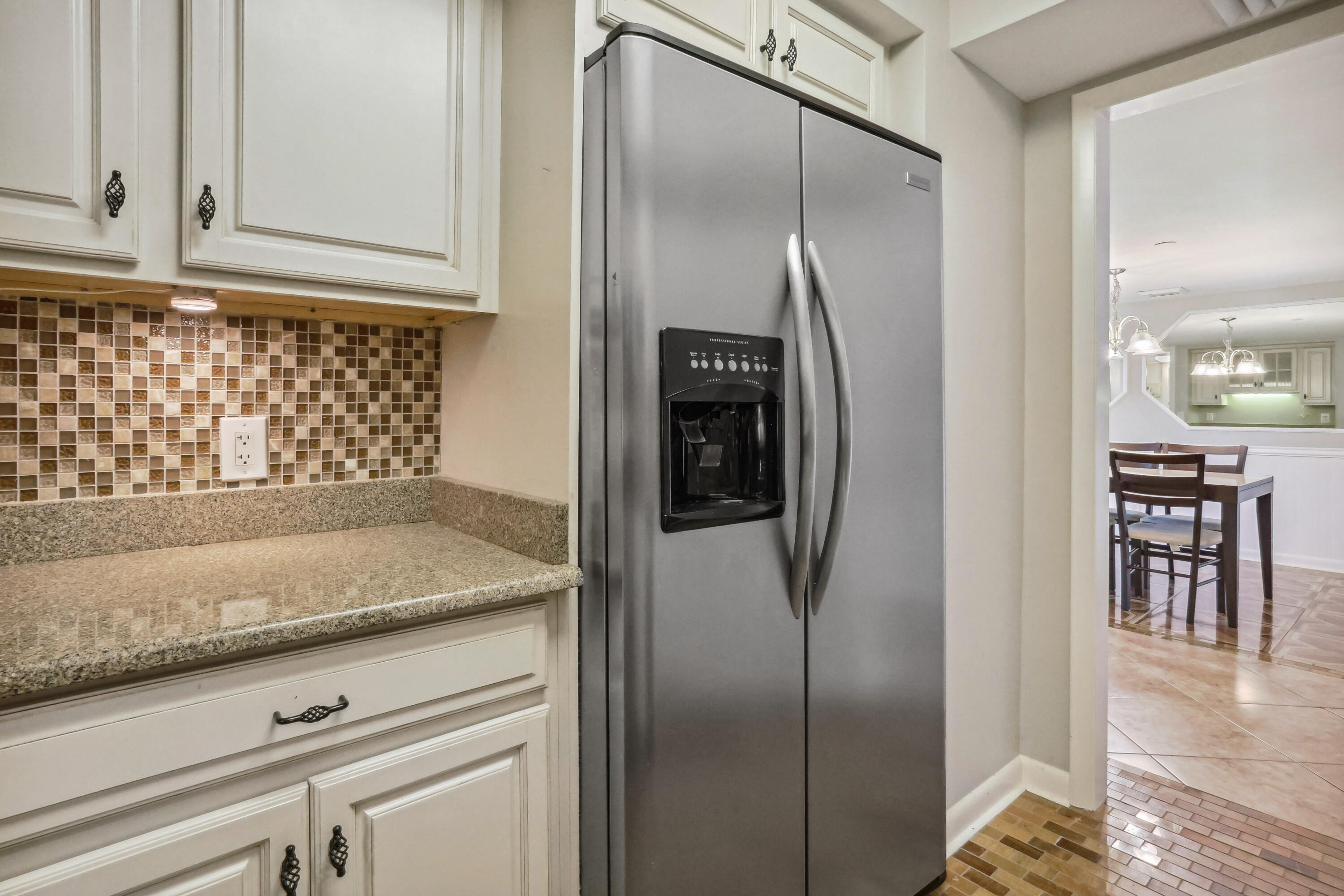 4201 North Ocean Boulevard, Unit 208 Boca Raton, FL 33431 - Photo 11 of 38 a view of a kitchen cabinets and refrigerator