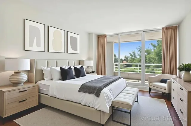 a bedroom with a bed and a large window