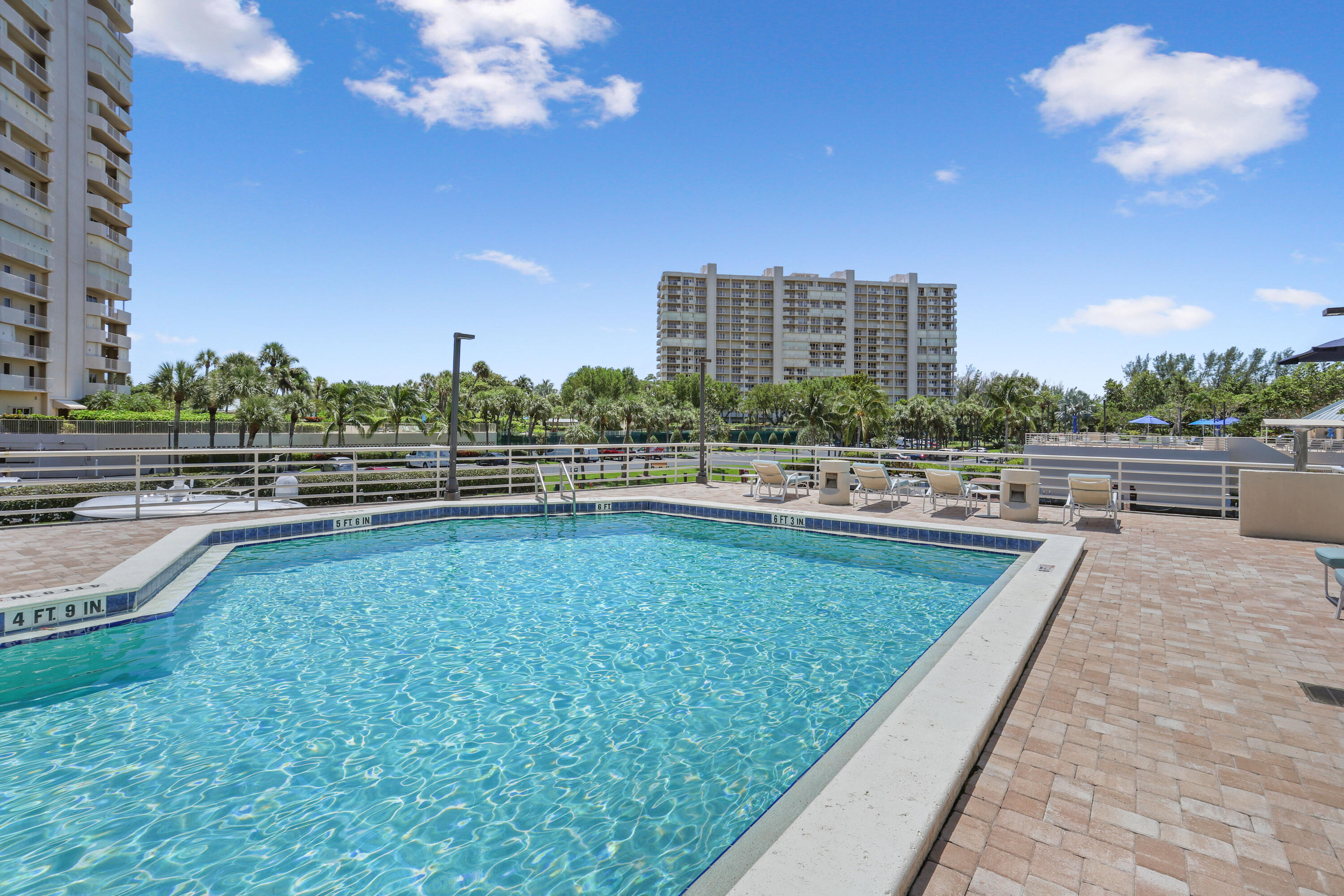 4201 North Ocean Boulevard, Unit 208 Boca Raton, FL 33431 - Photo 22 of 38 a view of swimming pool outdoor outdoor seating and city view