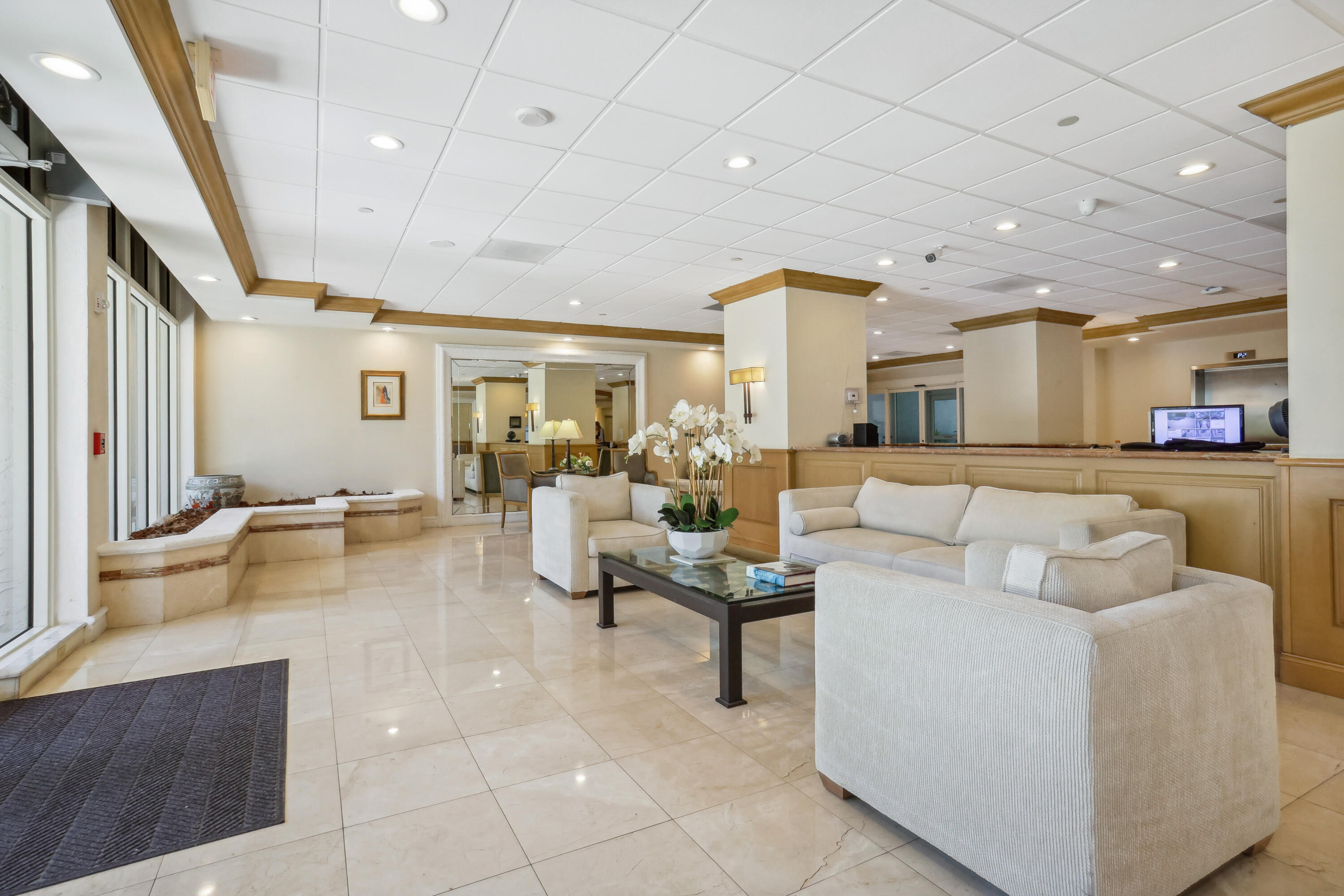 4201 North Ocean Boulevard, Unit 208 Boca Raton, FL 33431 - Photo 26 of 38 a living room with furniture and a large window