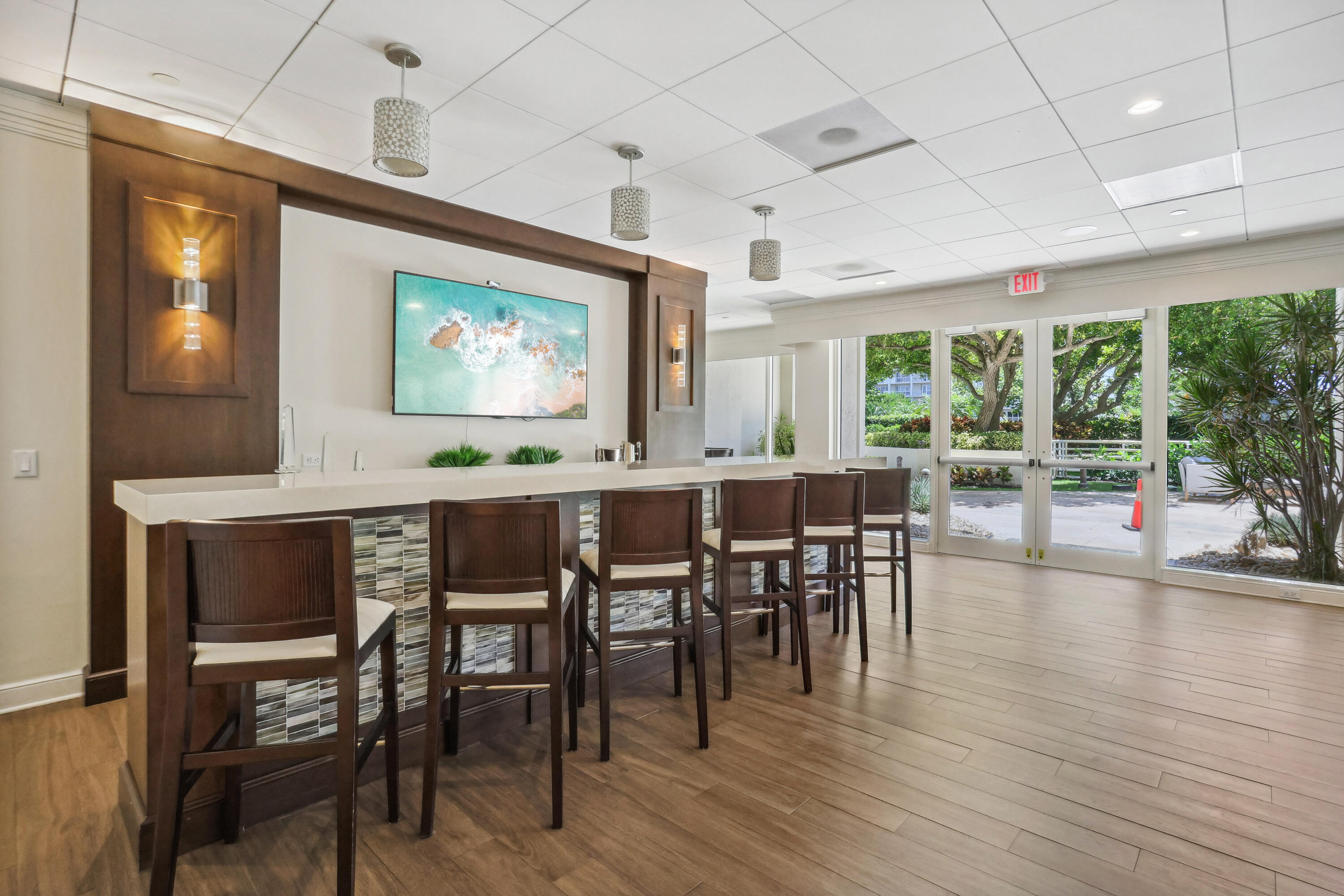 4201 North Ocean Boulevard, Unit 208 Boca Raton, FL 33431 - Photo 27 of 38 a view of a dining room with furniture window and wooden floor