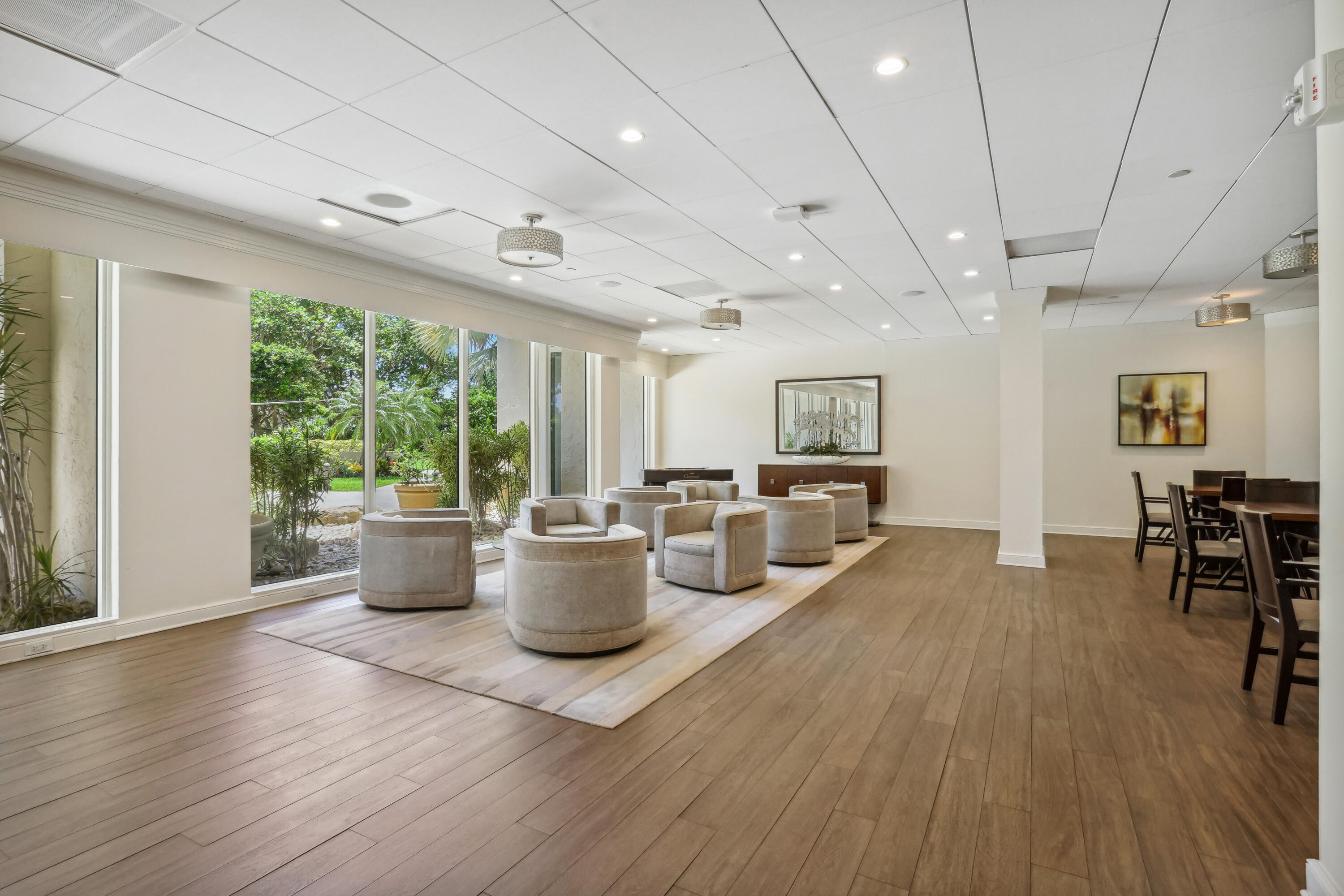 4201 North Ocean Boulevard, Unit 208 Boca Raton, FL 33431 - Photo 28 of 38 a very nice looking living room with a large window and wooden floor