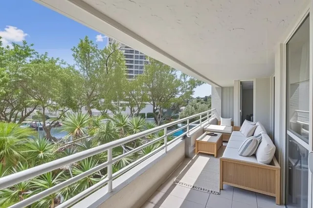 a view of two chairs in balcony