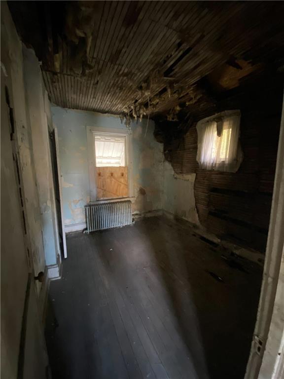 419 Maytide Street Pittsburgh, PA 15227 - Photo 12 of 28 a view of an empty room with wooden floor and a window