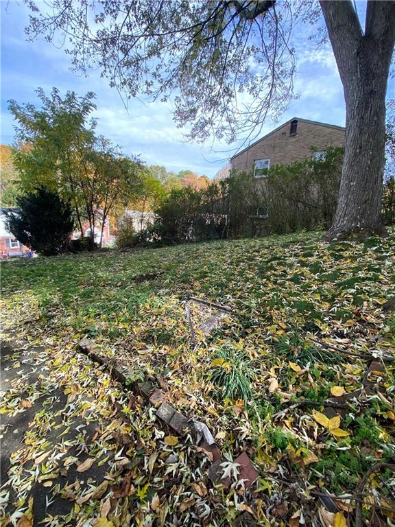 419 Maytide Street Pittsburgh, PA 15227 - Photo 23 of 28 a view of a yard with a tree