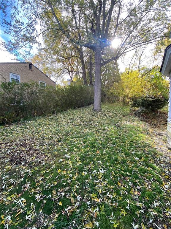 419 Maytide Street Pittsburgh, PA 15227 - Photo 24 of 28 a backyard of a house with lots of green space