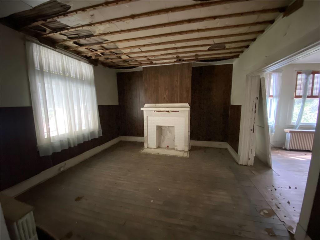 419 Maytide Street Pittsburgh, PA 15227 - Photo 6 of 28 a view of a room with a fireplace and windows