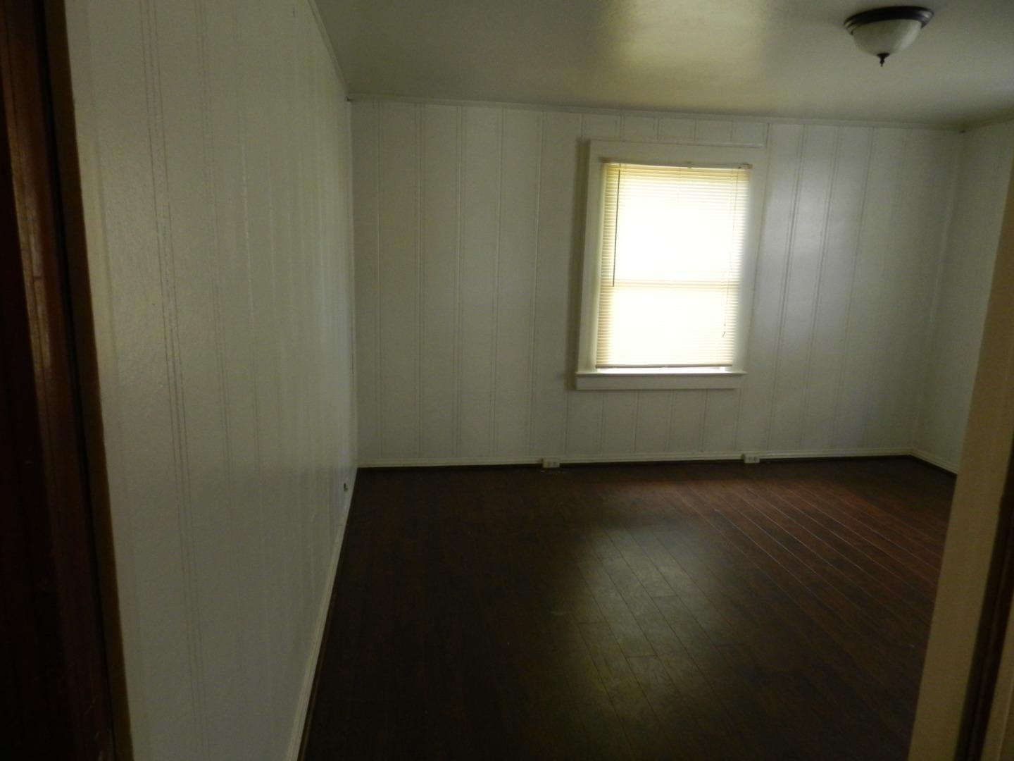 50 Katherine Avenue Salinas, CA 93901 - Photo 12 of 30 an empty room with wooden floor and windows