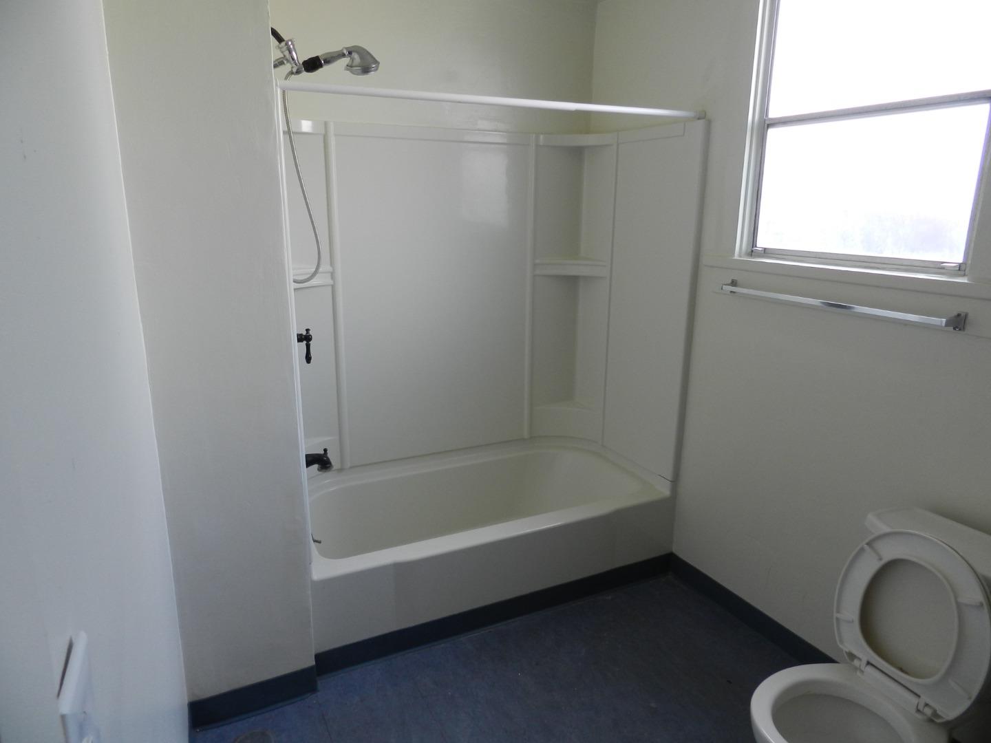 50 Katherine Avenue Salinas, CA 93901 - Photo 17 of 30 a bathroom with a bathtub a toilet and a shower
