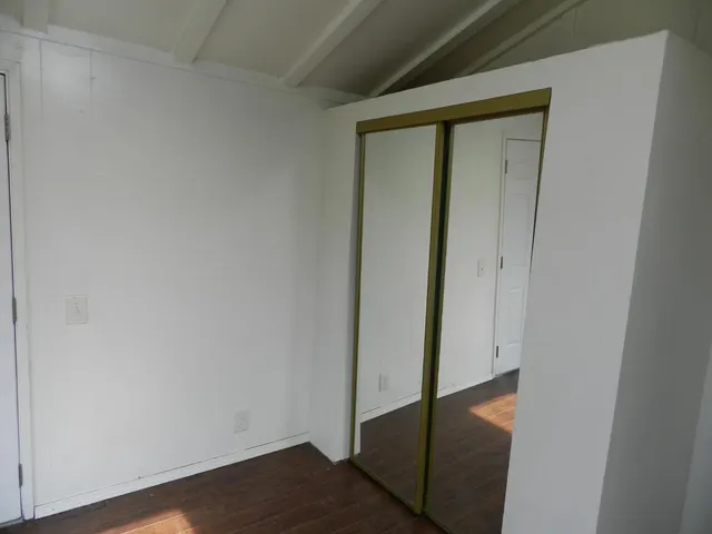 a view of front door with wooden floor