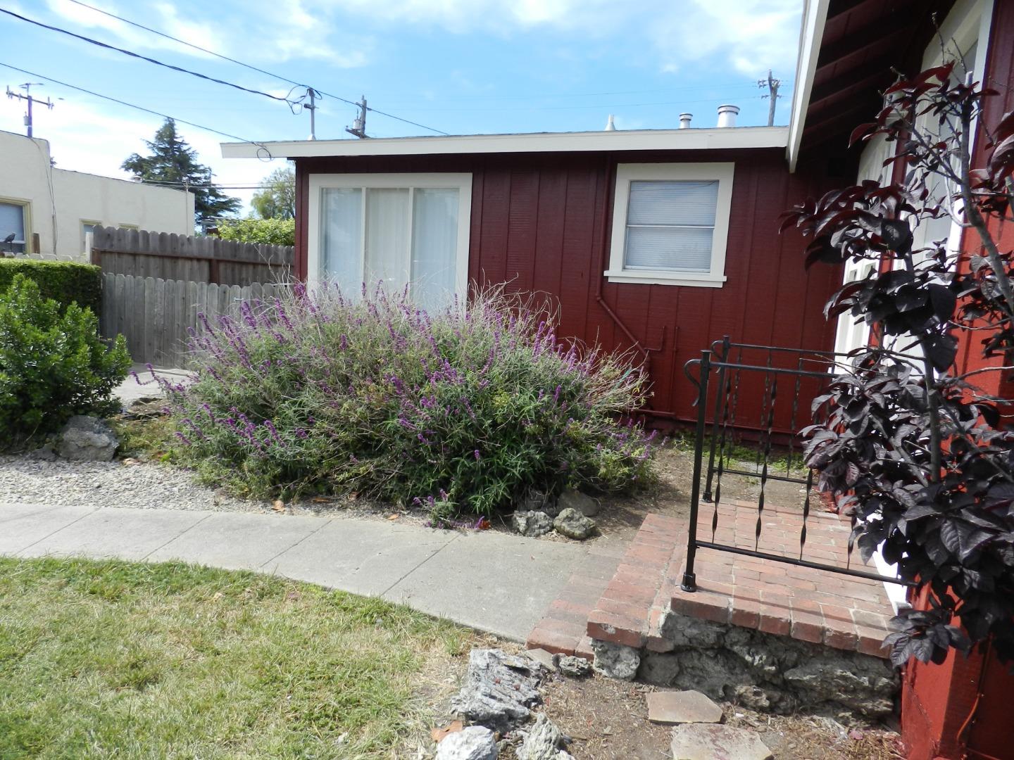 50 Katherine Avenue Salinas, CA 93901 - Photo 23 of 30 a flower garden is sitting in front of a house