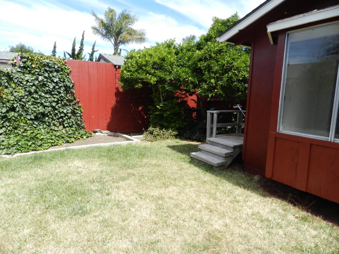 50 Katherine Avenue Salinas, CA 93901 - Photo 25 of 30 a view of a backyard with plants and a patio