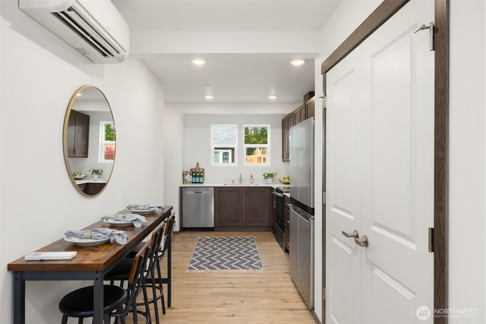 1359 Nolta Loop Northeast Bainbridge Island, WA 98110 - Photo 11 of 28 a bathroom with a sink a mirror and a bathtub
