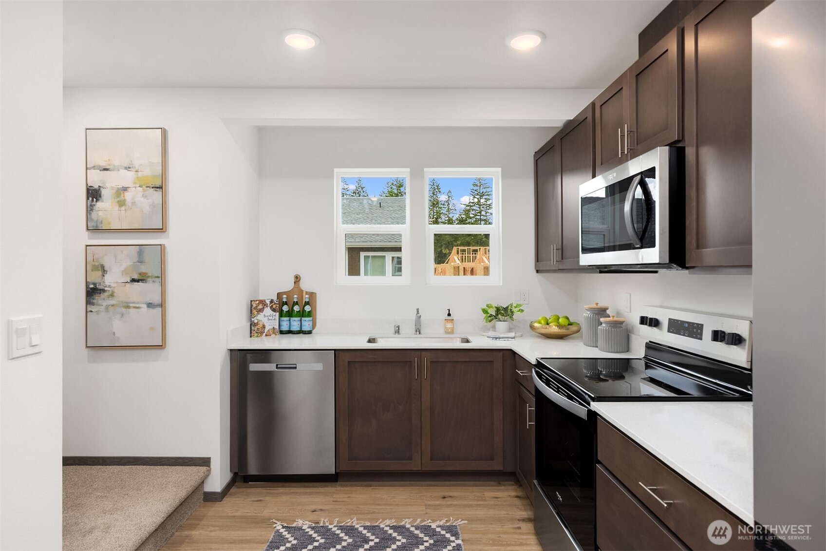1359 Nolta Loop Northeast Bainbridge Island, WA 98110 - Photo 14 of 28 a kitchen with stainless steel appliances a sink stove and refrigerator
