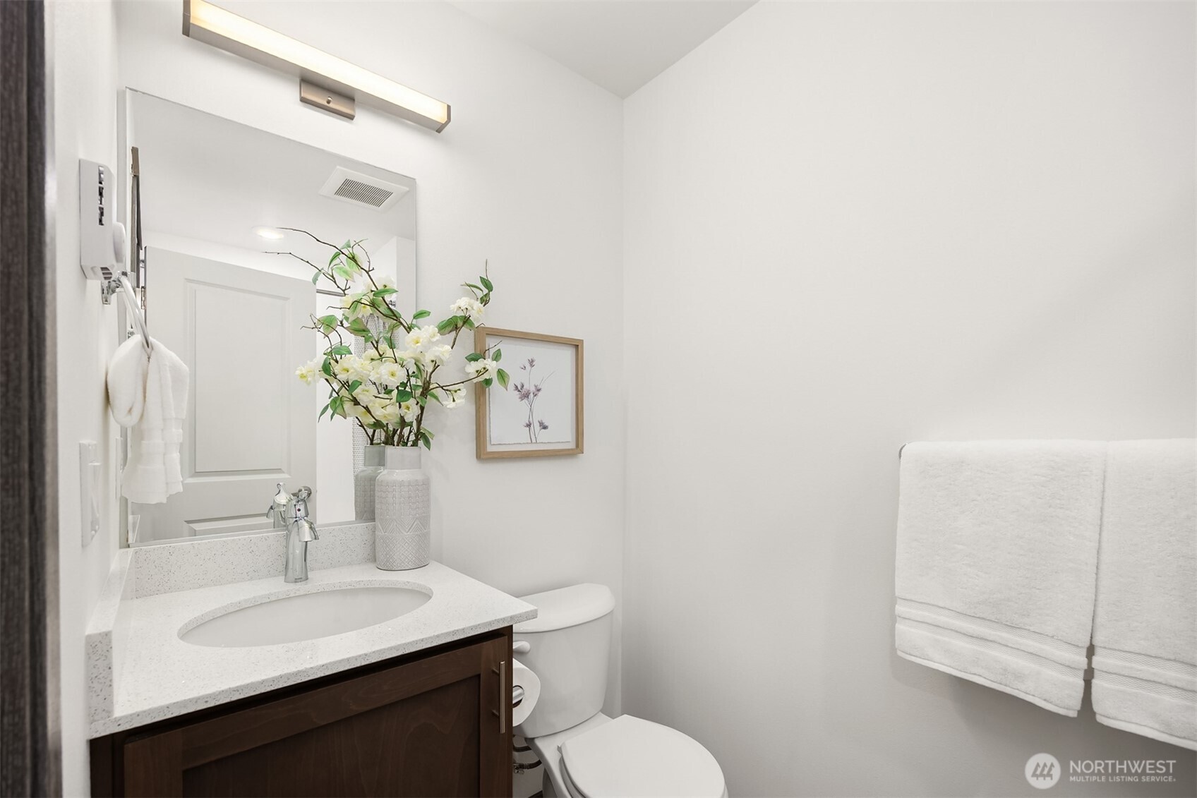 1359 Nolta Loop Northeast Bainbridge Island, WA 98110 - Photo 17 of 28 a bathroom with a sink vanity mirror and toilet