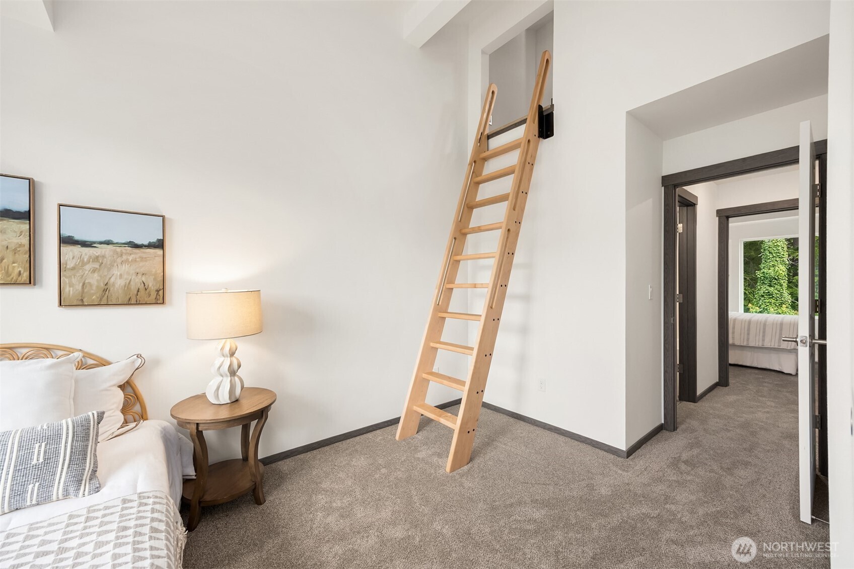 1359 Nolta Loop Northeast Bainbridge Island, WA 98110 - Photo 21 of 28 a view of a bedroom with furniture and a window