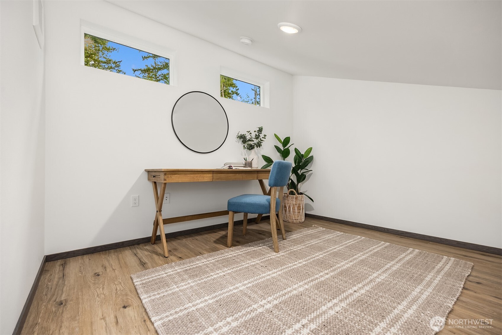 1359 Nolta Loop Northeast Bainbridge Island, WA 98110 - Photo 22 of 28 a room with a table and a chair