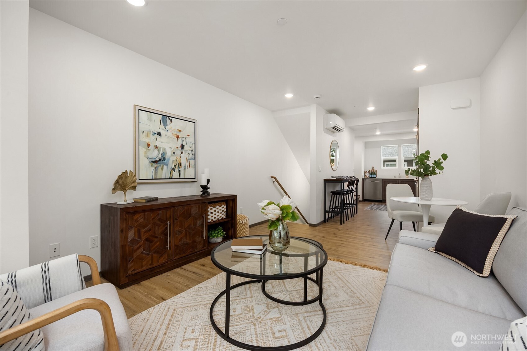 1359 Nolta Loop Northeast Bainbridge Island, WA 98110 - Photo 8 of 28 a living room with furniture and a chandelier
