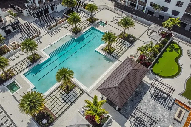 a kitchen with stainless steel appliances granite countertop a sink and white cabinets