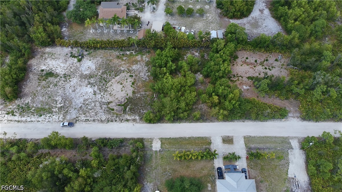 6430 Mannheim Road Bokeelia, FL 33922 - Photo 7 of 9 an aerial view of a house with a yard