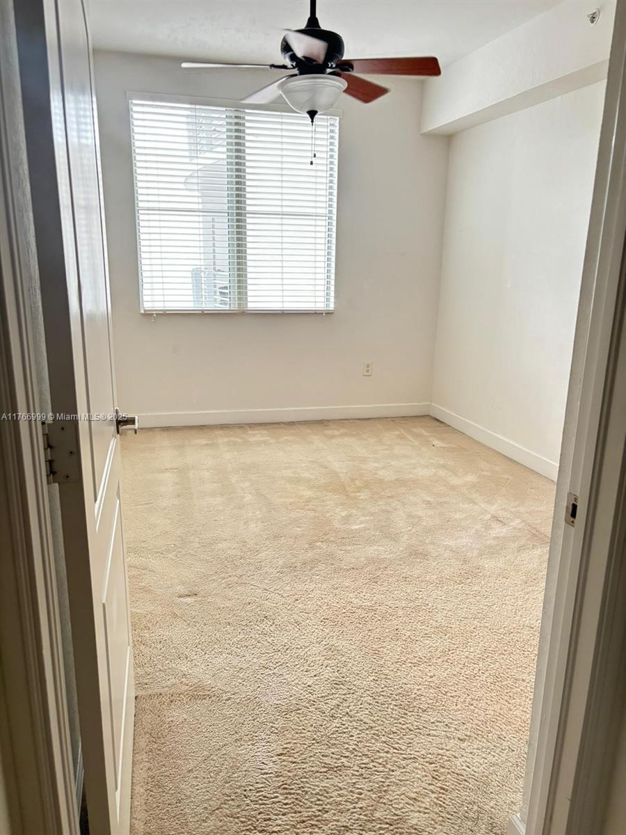 1830 Radius Drive, Unit 604 Hollywood, FL 33020 - Photo 12 of 22 a view of an empty room with a window