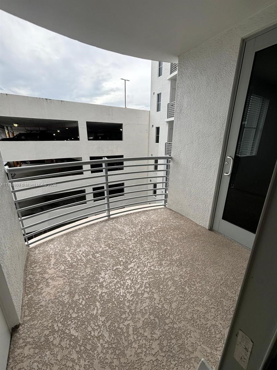 1830 Radius Drive, Unit 604 Hollywood, FL 33020 - Photo 15 of 22 a view of an empty room and a kitchen