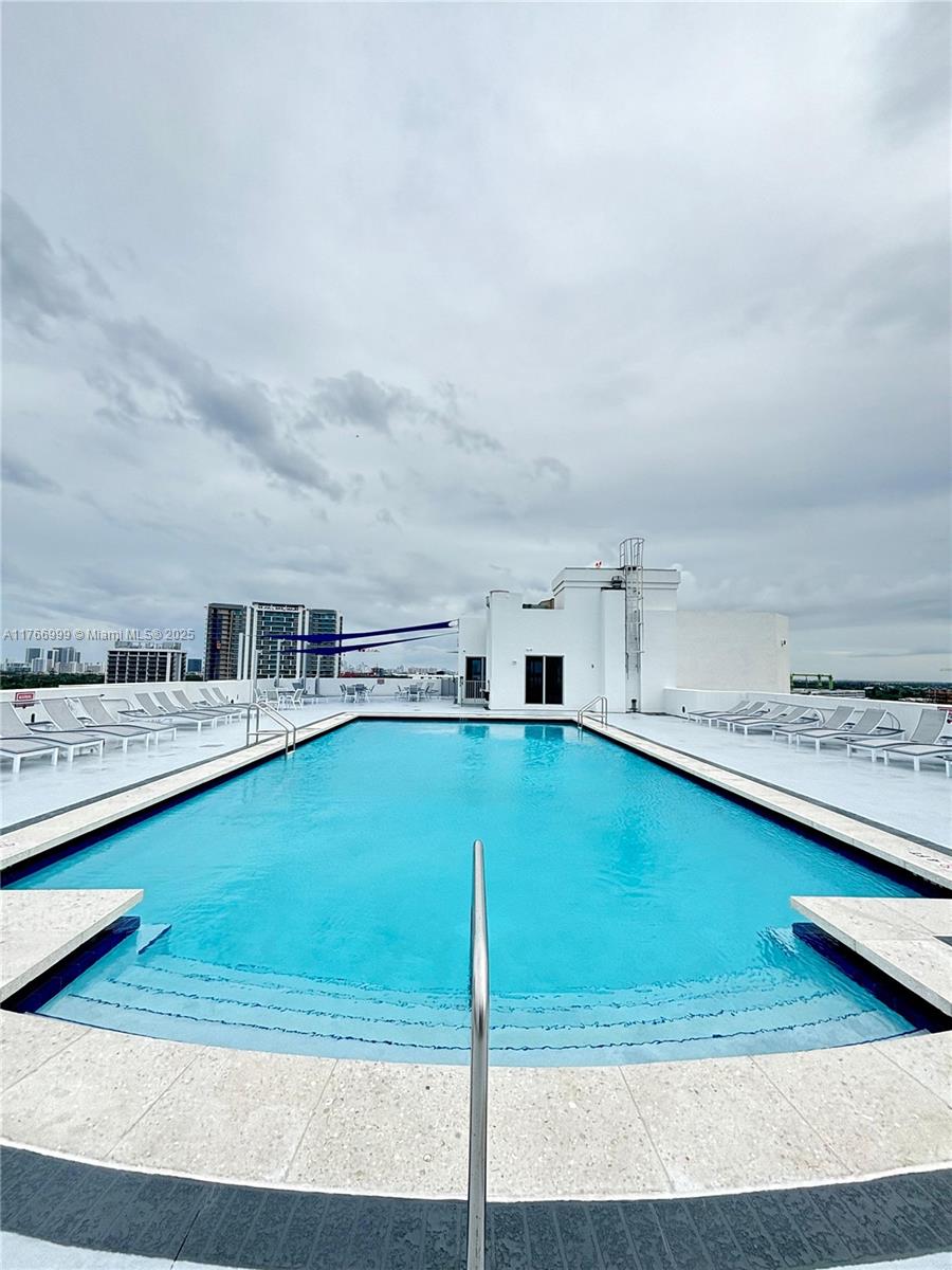 1830 Radius Drive, Unit 604 Hollywood, FL 33020 - Photo 17 of 22 a view of a swimming pool and a yard