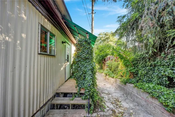 a view of a house with wooden fence