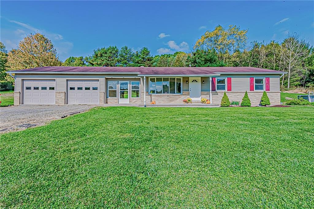 a view of a house with a big yard