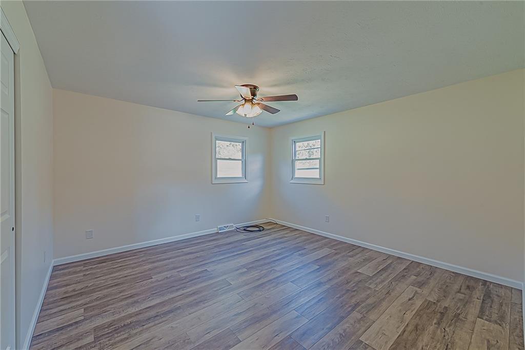 510 Crooks Road Home, PA 15747 - Photo 11 of 20 wooden floor in an empty room with a window
