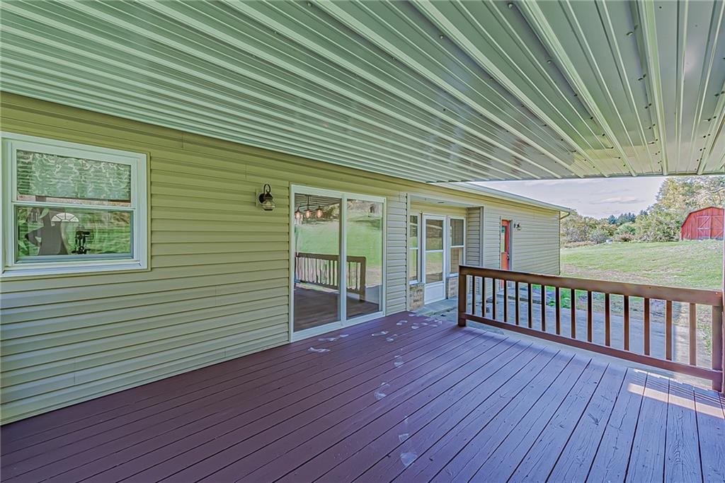 510 Crooks Road Home, PA 15747 - Photo 13 of 20 a view of backyard with a deck and wooden floor